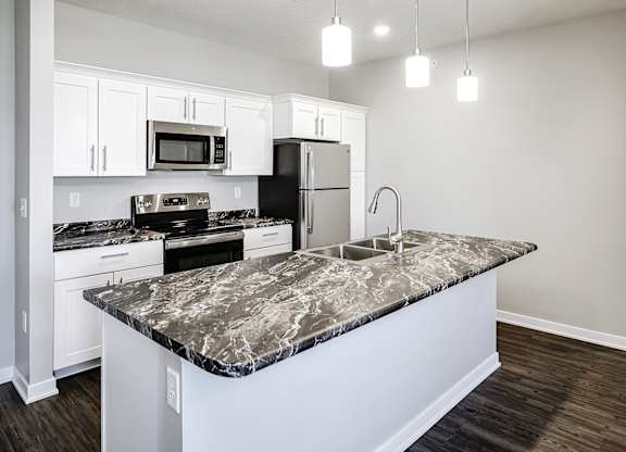 Kitchen island at Deerfield Apartments and Chateaus in Fremont, NE