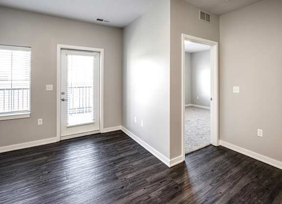 Living Room with balcony at Deerfield Apartments and Chateaus in Fremont, NE