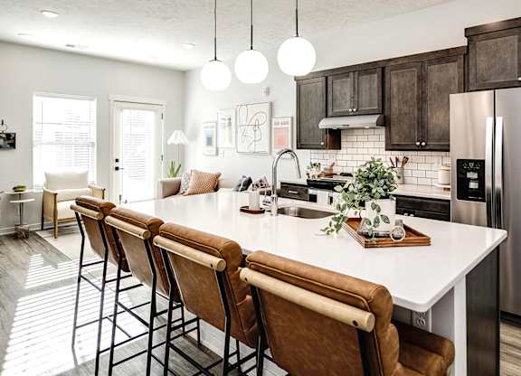 Modern one- and two-bedroom apartments featuring stainless steel appliances, high-end lighting, premium LVT flooring, granite countertops and more at The Ridgeline in Council Bluffs, IA