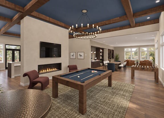 A large room with a pool table and a fireplace.