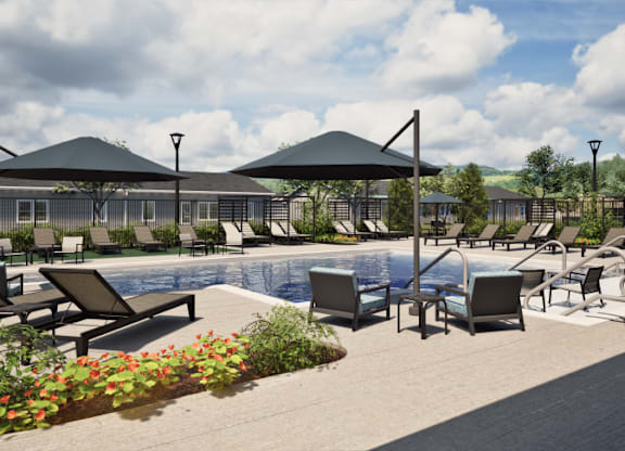 A poolside area with sun loungers and umbrellas.