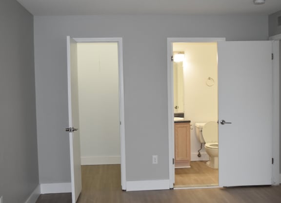 A bathroom is visible through an open door at Sunnymede Apartments in Troy, MI