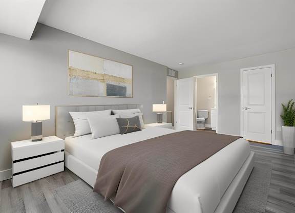 a bedroom with a white bed and a gray blanket at Sunnymede Apartments - Troy, MI, Troy, 48084