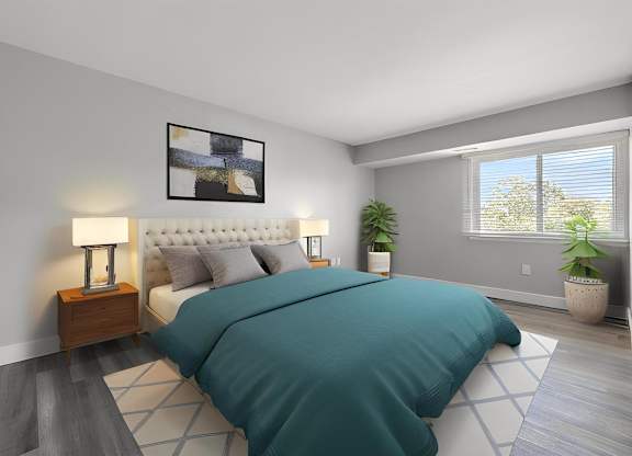 a bedroom with a bed and a window at Sunnymede Apartments - Troy, MI, Michigan