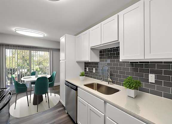 a kitchen with white cabinets and a sink at Sunnymede Apartments - Troy, MI, Troy, Michigan
