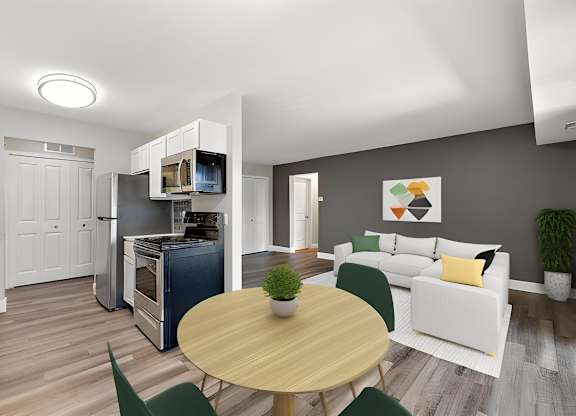 a living room and dining room with a table and chairs at Sunnymede Apartments - Troy, MI, Troy, 48084