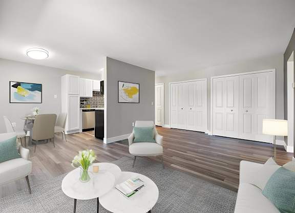 a living room with a couch and chairs and a table at Sunnymede Apartments - Troy, MI, Troy, Michigan