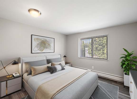 a bedroom with a large bed and a window at Town & Country Apartments - Wixom, MI, Wixom, 48393
