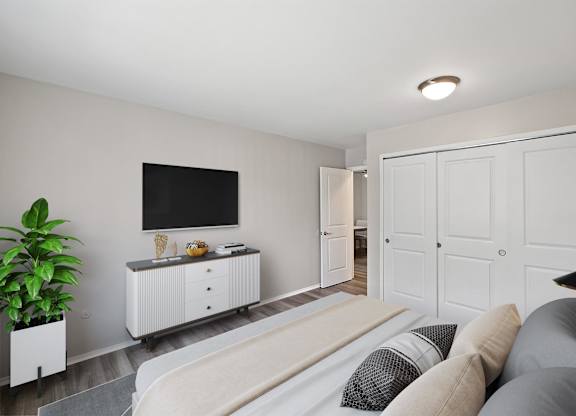 couch and a tv at Town & Country Apartments - Wixom, MI, Wixom, Michigan