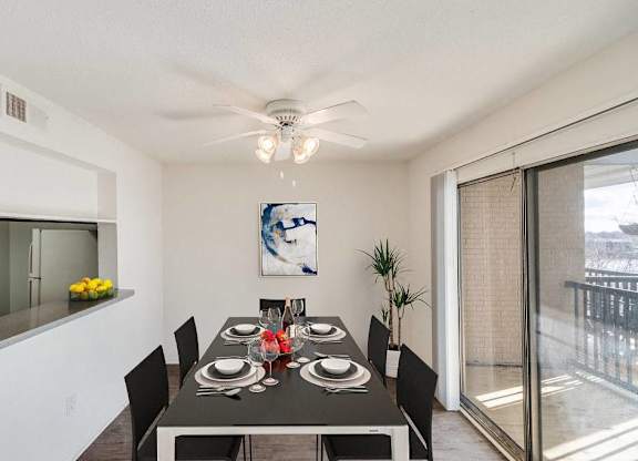 A dining room with a table set for six people at The Waverly on the Lake - Belleville, MI Apartment , Belleville, 95050