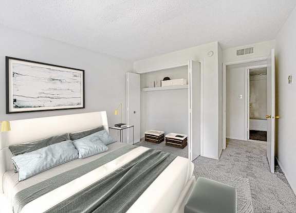 A bedroom with a bed, nightstands, and a painting on the wall at The Waverly on the Lake - Belleville, MI Apartment, Belleville, MI, 95050