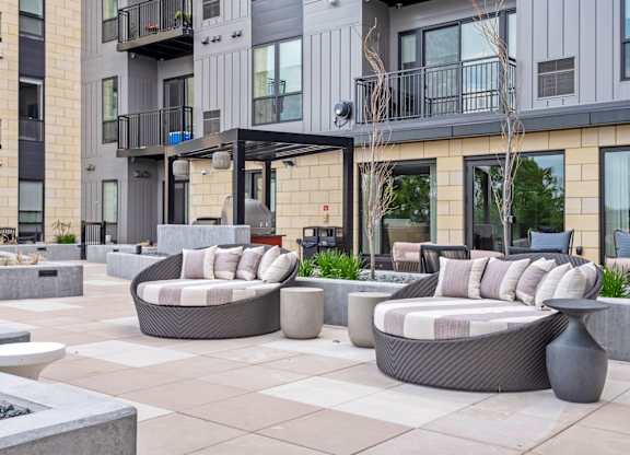 Zen Terrace with Lounge Chairs and Grills at Lilia Apartments in Lilydale, MN 55118