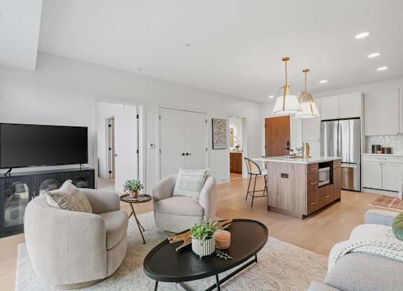 Living room in a one-bedroom, one-bathroom apartment home at Lilia in Lilydale, MN 55118