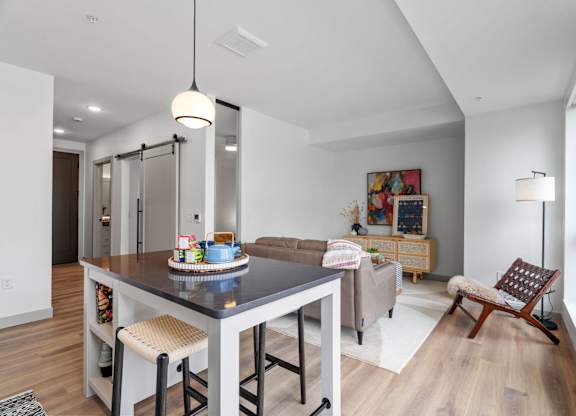 a living area with a dining table and a couch at The Mera, Minnesota