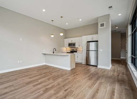 Kitchen with a refrigerator at Expo Apartments, Minnesota