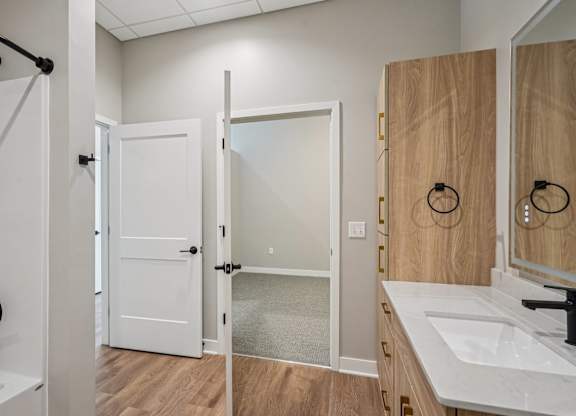 Bathroom with a white sink at Expo Apartments, Minneapolis