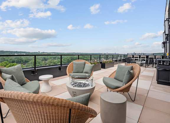 Top Floor Terrace attached to The Parlour and the Tea Room with fire pits and chairs at Lilia Apartments in Lilydale, MN 55118