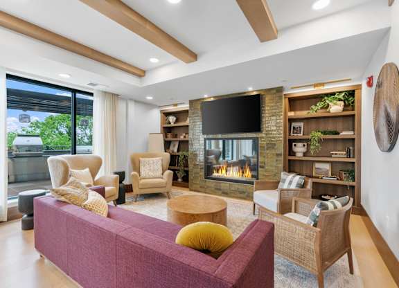 Bench seating across from the fireplace in the Private Dining Room, a reservable community room at Lilia in Lilydale, MN 55118