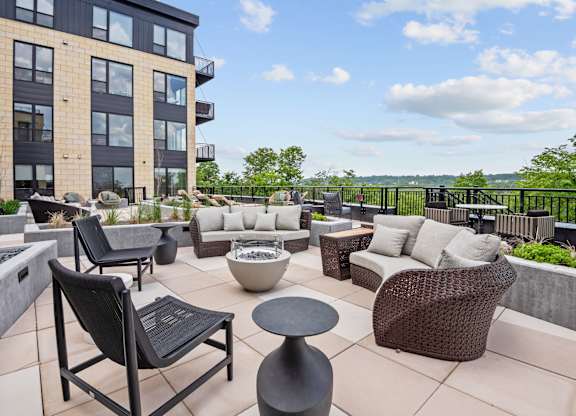 Zen Terrace with Lounge Chairs and Grills at Lilia Apartments in Lilydale, MN 55118