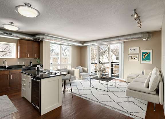 a kitchen and living room in a 555 waverly unit at Be @ Axon Green, Minneapolis, MN