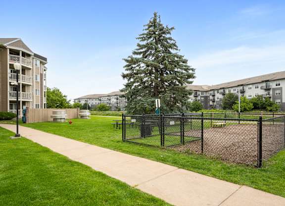 the preserve at ballantyne commons tennis courts with apartments in the background at Cityscape, St Louis Park, 55416