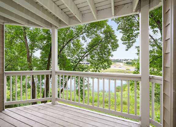 the view from the porch of a house overlooking a lake at Cityscape, St Louis Park, MN, 55416