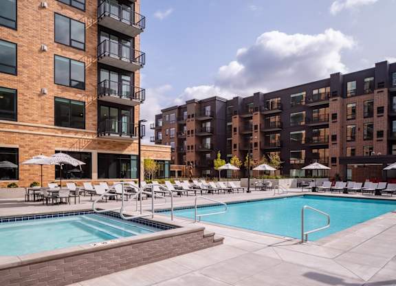 a swimming pool in front of a large apartment building at Expo, Minneapolis Minnesota