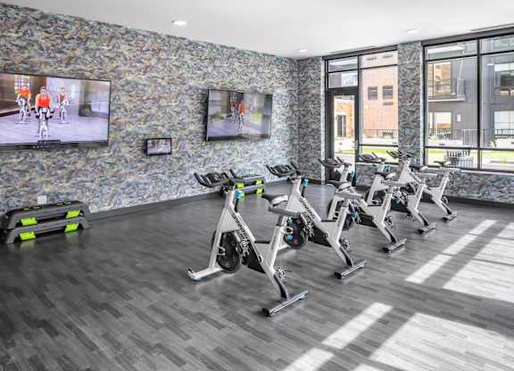 a gym with treadmills and exercise balls on the floor at Expo, Minneapolis, MN