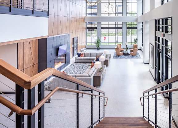 the lobby of an office building with stairs and couches at Expo, Minneapolis, MN 55414