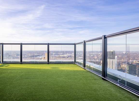 a lawn on the balcony of a skyscraper with a city view at Expo, Minneapolis, MN