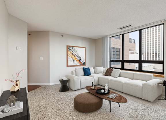 Living room with couch at Galtier Towers Apartments, St. Paul, MN