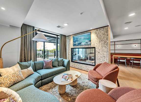 A living room with a large couch and a coffee table.at Lilia, Lilydale, MN