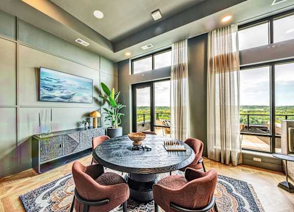 A modern dining room with a large table and chairs.at Lilia, Minnesota, 55118