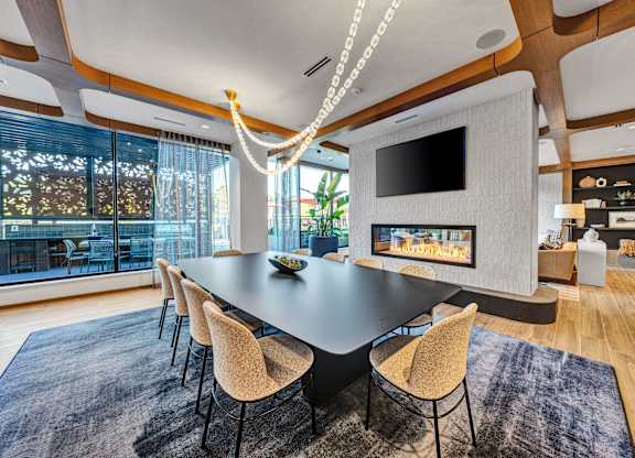 A modern dining room with a large table and chairs. at The Mera, St Louis Park, Minnesota