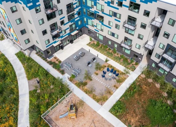 an aerial view of an apartment building with a courtyard at Zelia on Seven, Minnesota, 55416