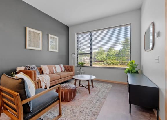 a living room with a couch and a window at Zelia on Seven, Minnesota