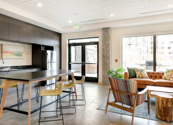 Club room kitchen with high-top counter and seating area
