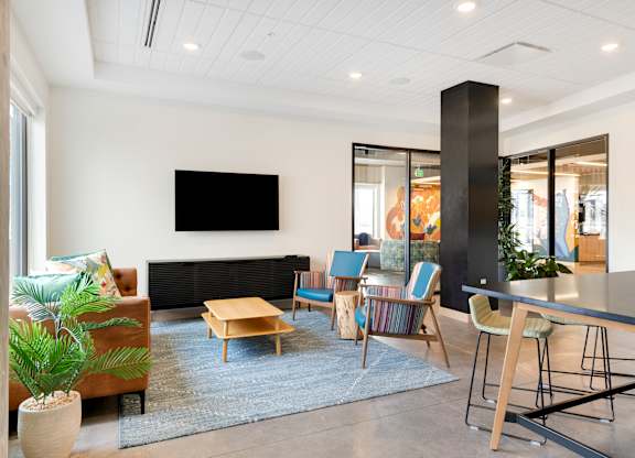 Club room with tables, chairs and tv
