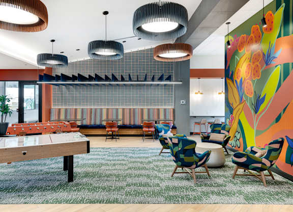Amenity space with seating, air hockey table and foosball
