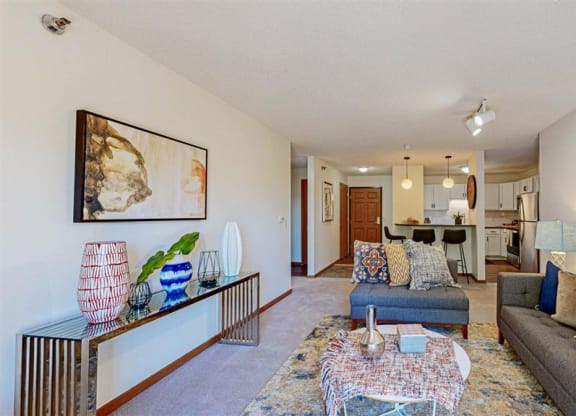 a living room with couches  and a table