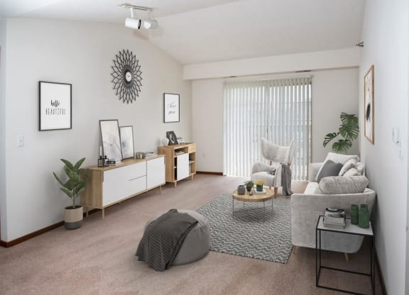 an empty living room with a couch and a table