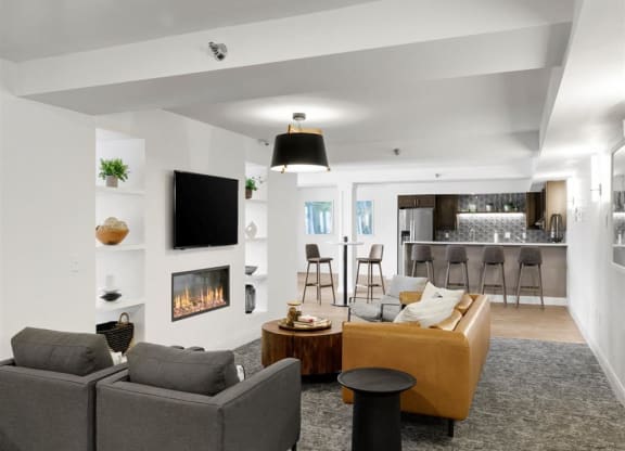 a shared community room with television, couch, chairs.