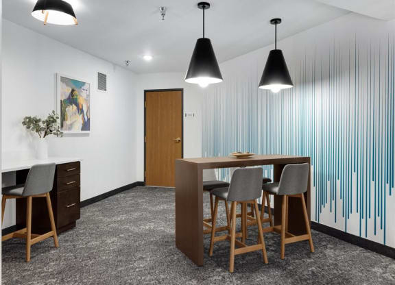 a business center with a table and chairs