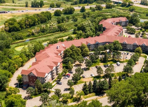 an aerial view of a campus with buildings and trees