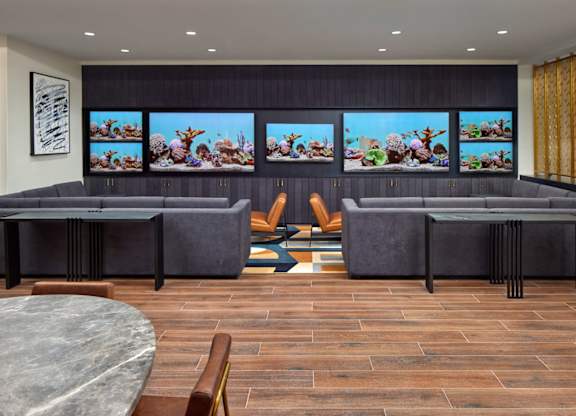 A modern living room with a grey sofa and a coffee table.