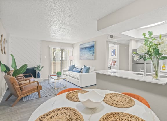 a living room and dining room with a table and chairs at District 2308, Arlington Texas?