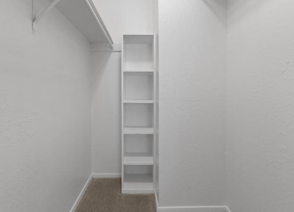 the closet in a small apartment with shelves and a window at District 2308, Arlington Texas?