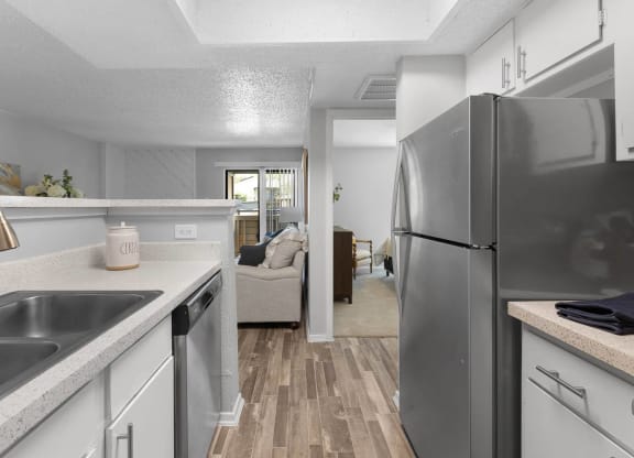 a kitchen with a sink and a refrigerator at District 2308, Texas, 76011
