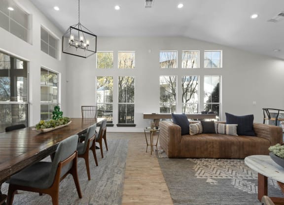 a living room with a long wooden table and a couch at District 2308, Arlington, 76011 ?