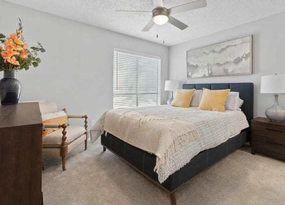 a bedroom with a bed and a ceiling fan at District 2308, Arlington ?